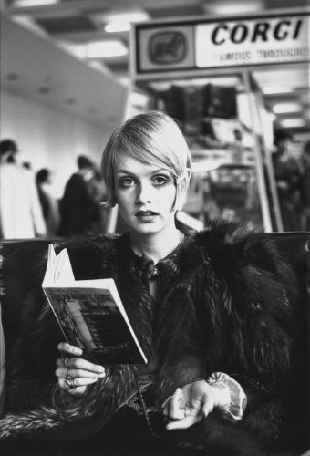 17th October 1967: British model Twiggy reading a guide book to Tokyo at London Airport before departing for Japan, where she will be modelling a fashion collection. (Photo by Jim Gray/Keystone/Getty Images)